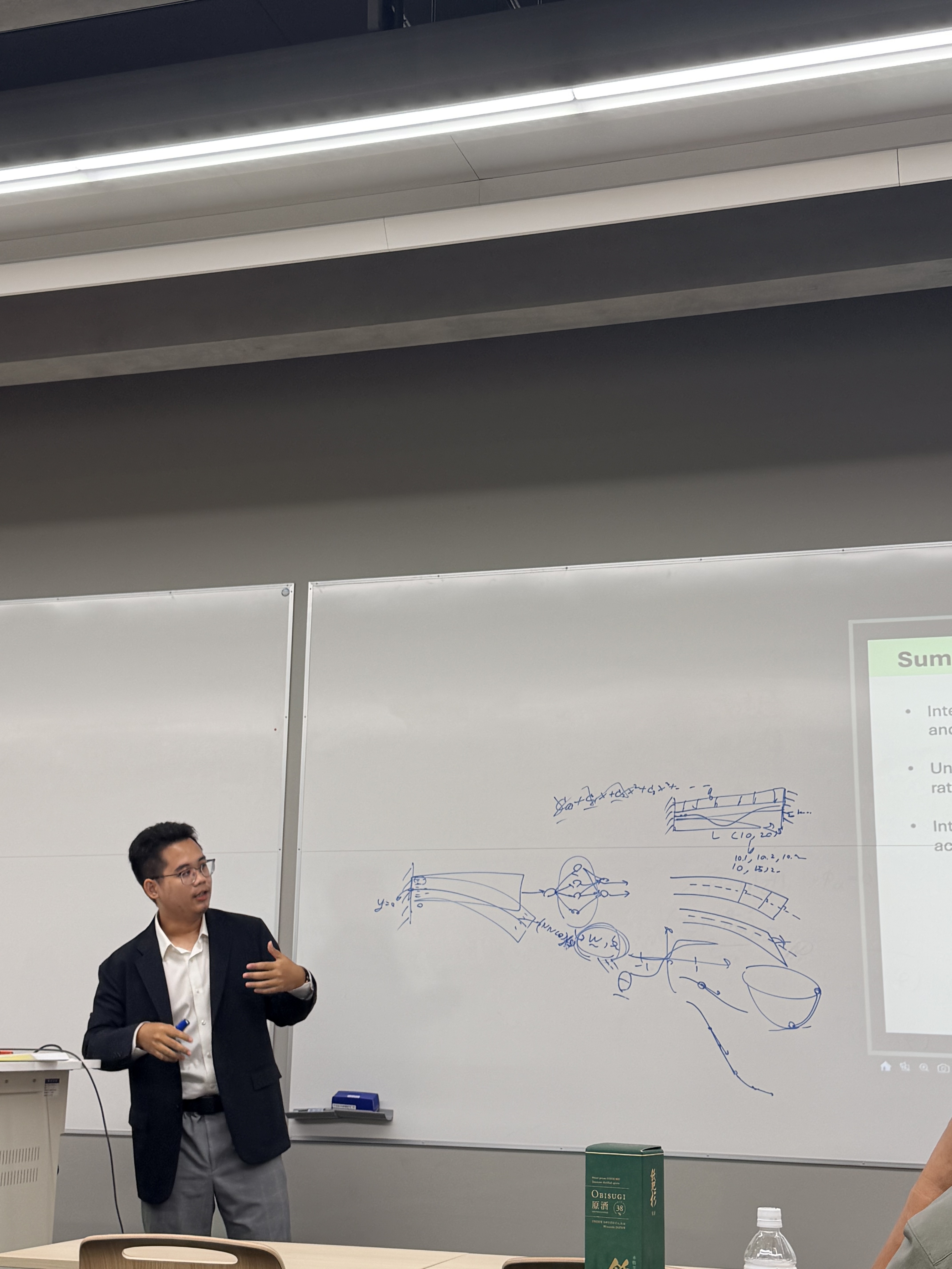 Discussing physics-informed neural network formulations during the presentation